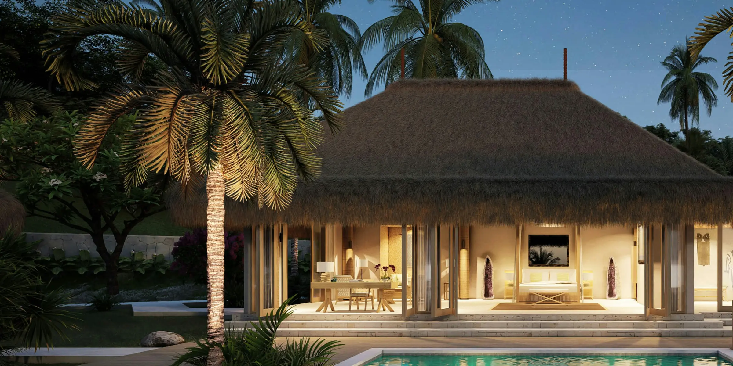 A single-story South Florida home at dusk, palm trees and lit windows